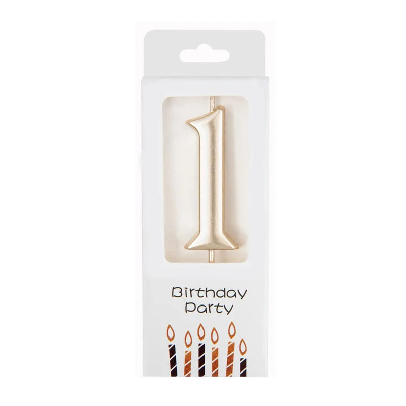 A gold number candle shaped like the number one for birthday party decor.