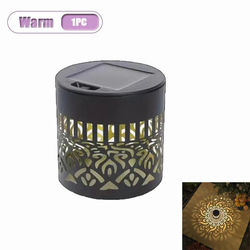 A dark wall lantern with a decorative cutout pattern, designed for garden and patio use.