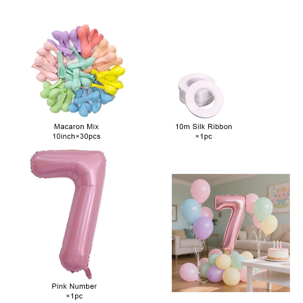 Un assortiment de macarons colorés, un ruban de soie de 10m et un ballon en feuille rose.