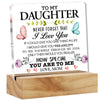 A personalized acrylic desk sign with a floral design and the message I love you to my daughter