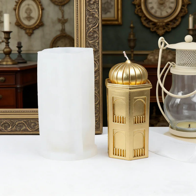 A golden silicone candle mold set featuring a dome-shaped candle resting on a decorative gold container.