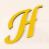 A large, gold 3D acrylic letter H is shown against a light background.