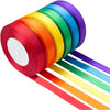 A roll of satin silk ribbon in a rainbow spectrum, showing various colors like red, orange, yellow, green, blue, and purple.
