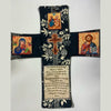 A handcrafted pocket shrine featuring a cross and religious icons on a dark fabric background.