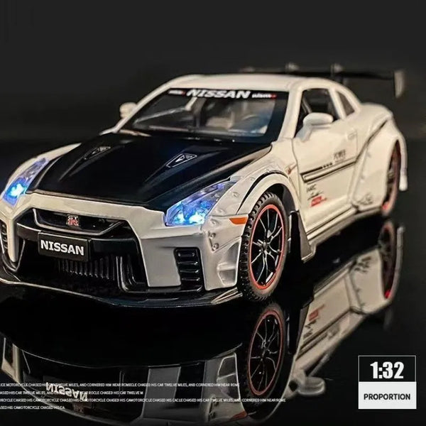 A black and white Nissan GT-R sports car model in 1:32 scale with lights and sound.