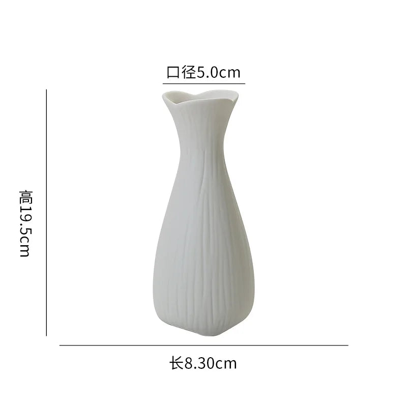 White ceramic desktop vase with an organic ripple design, measuring 19.5cm high and 8.30cm long.