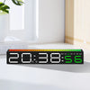 A black LED digital alarm clock displaying 20:38:56 with a green display, resting on a white surface.