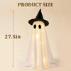 Figura fantasma blanca con sombrero de bruja negro y rasgos brillantes, vista contra fondo claro.