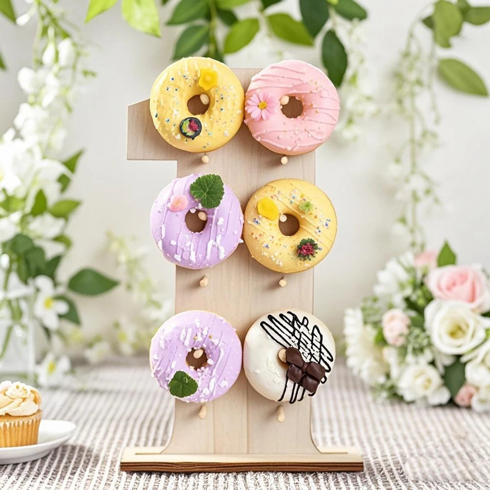 A wooden number display stand featuring donuts and cupcakes for desserts.