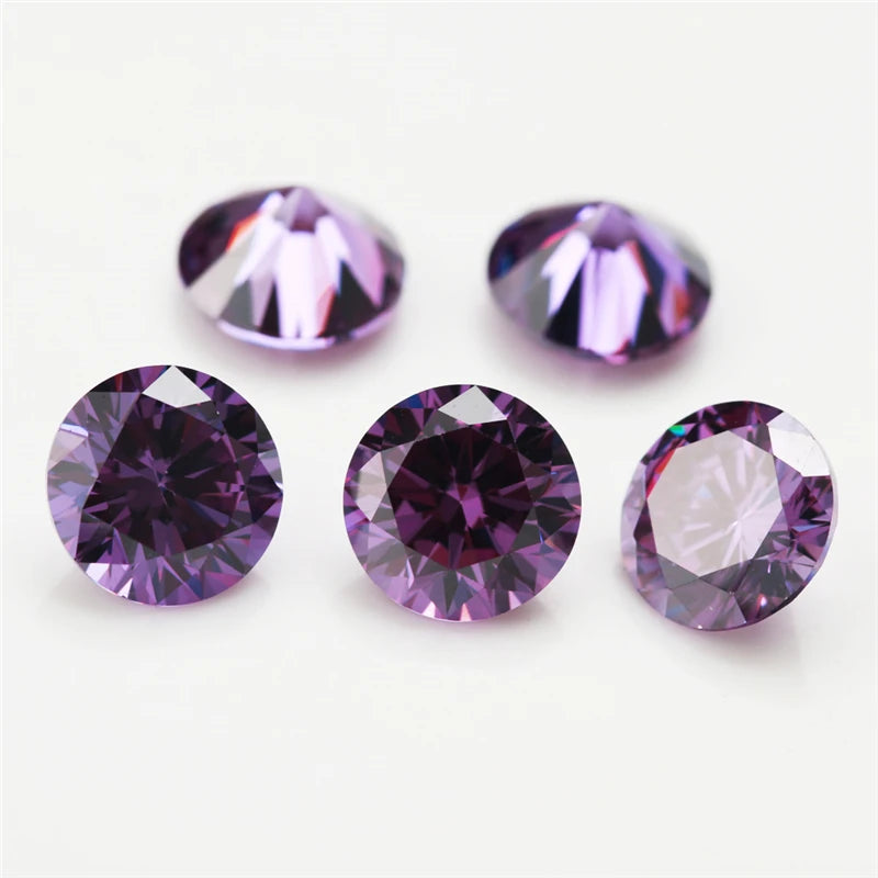 A collection of round cut purple and pink cubic zirconia loose stones for jewelry making.
