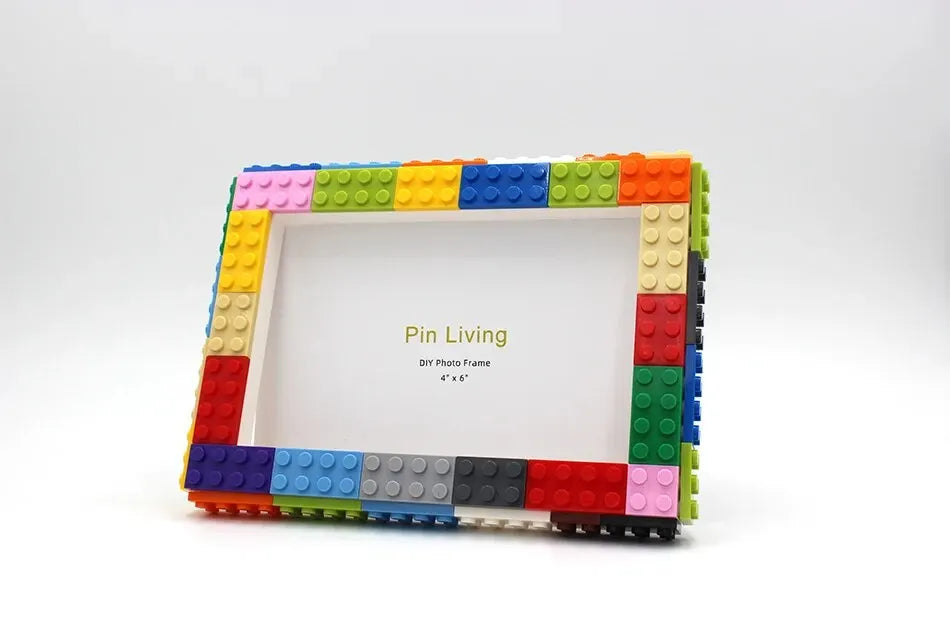 A colorful building block frame kit with a white photo area and surrounding blocks.