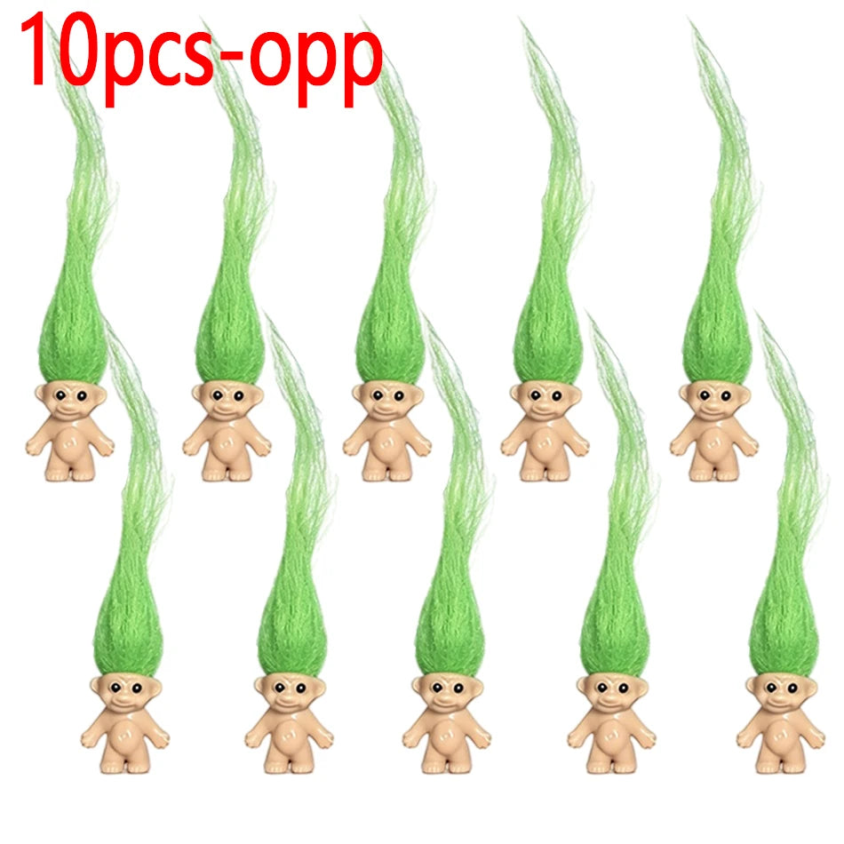 Ten small green troll dolls in various poses and styles.