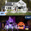 Giant purple spider web Halloween light featuring a large black spider and jack-o'-lanterns.