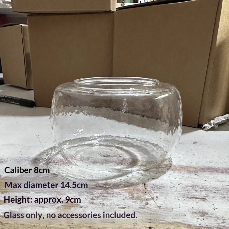 Clear glass decor vase with a wide mouth, measuring 8cm in caliber and 9cm high.