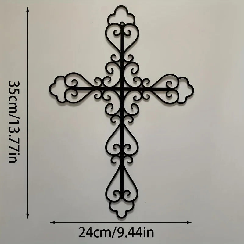 Black metal cross wall decor with ornate scrollwork, measuring 24cm long and 35cm high.