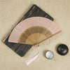 Traditional Bamboo Folding Fan with Solid Color Design