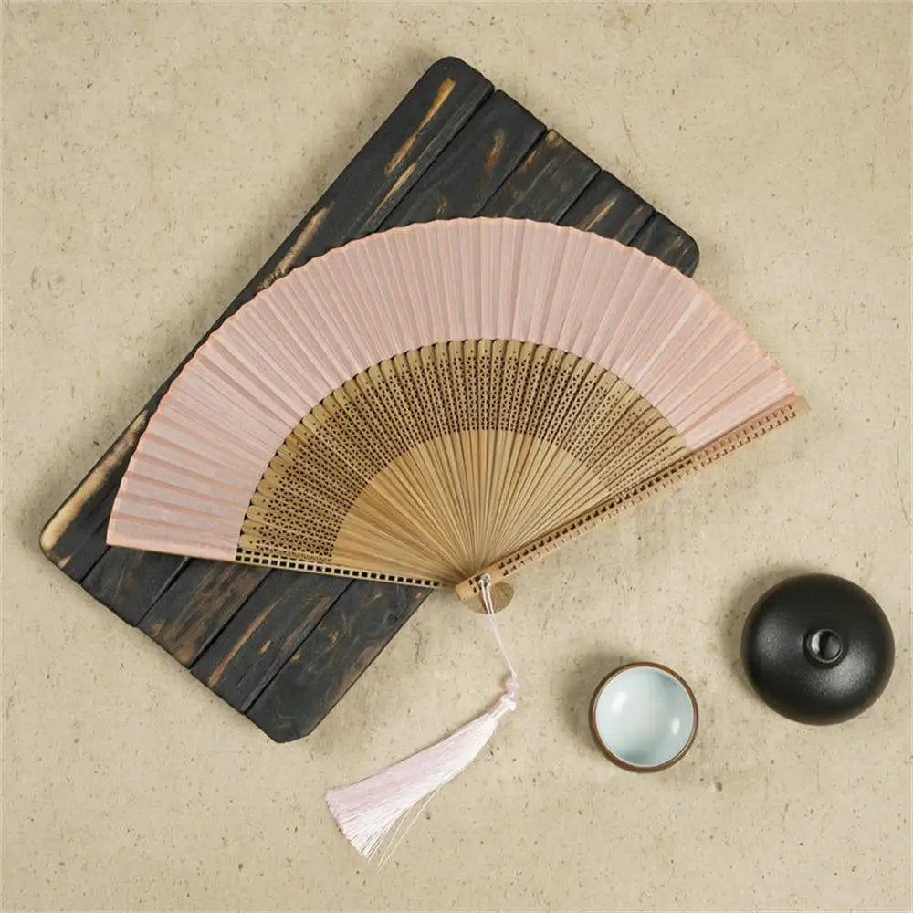 Traditional Bamboo Folding Fan with Solid Color Design