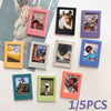A collection of colorful magnetic photo frames and magnets displayed on a white surface.