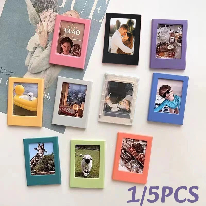 A collection of colorful magnetic photo frames and magnets displayed on a white surface.