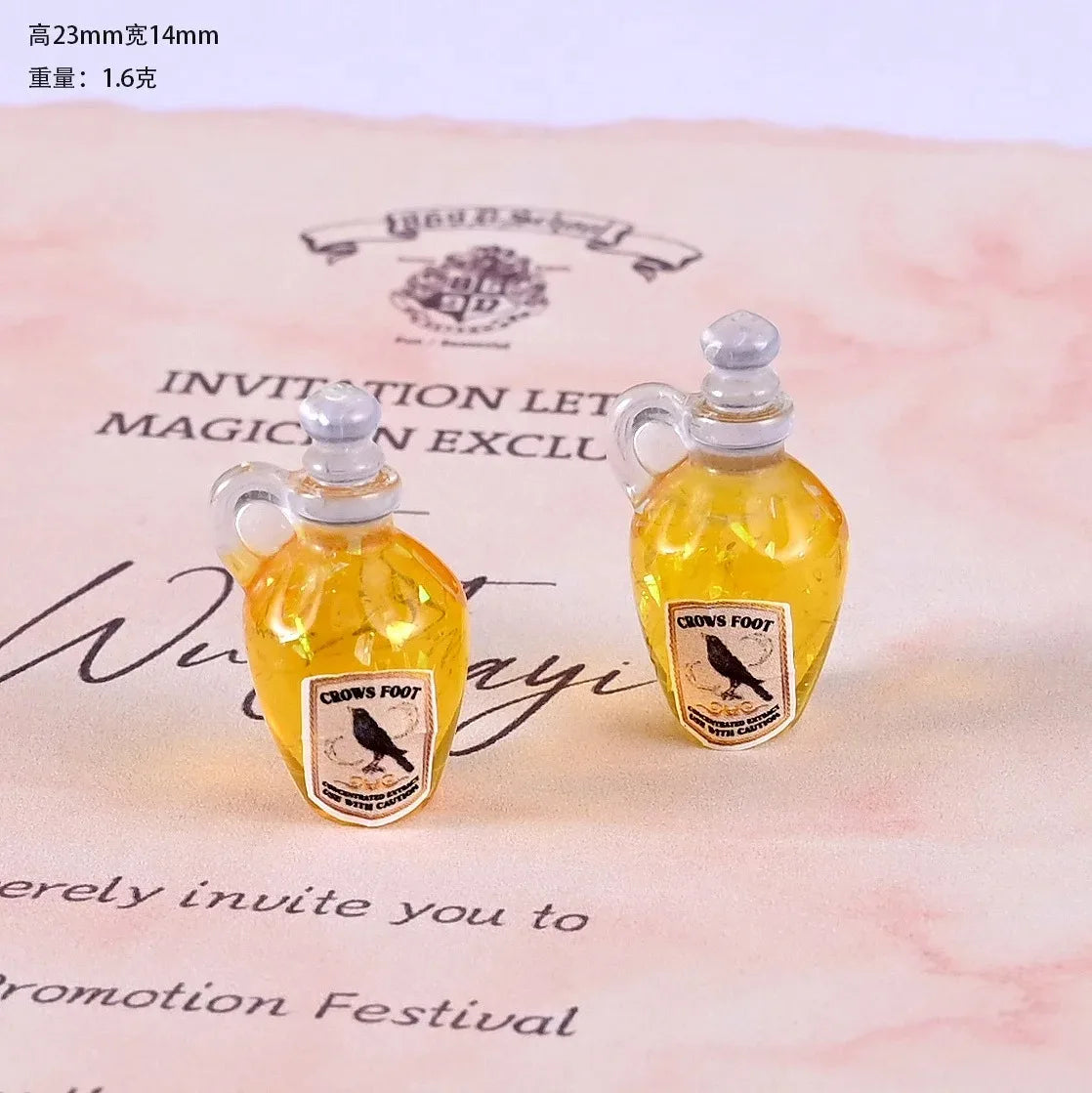 Two miniature resin magic potion bottles with yellow liquid and black bird labels for dollhouse decor
