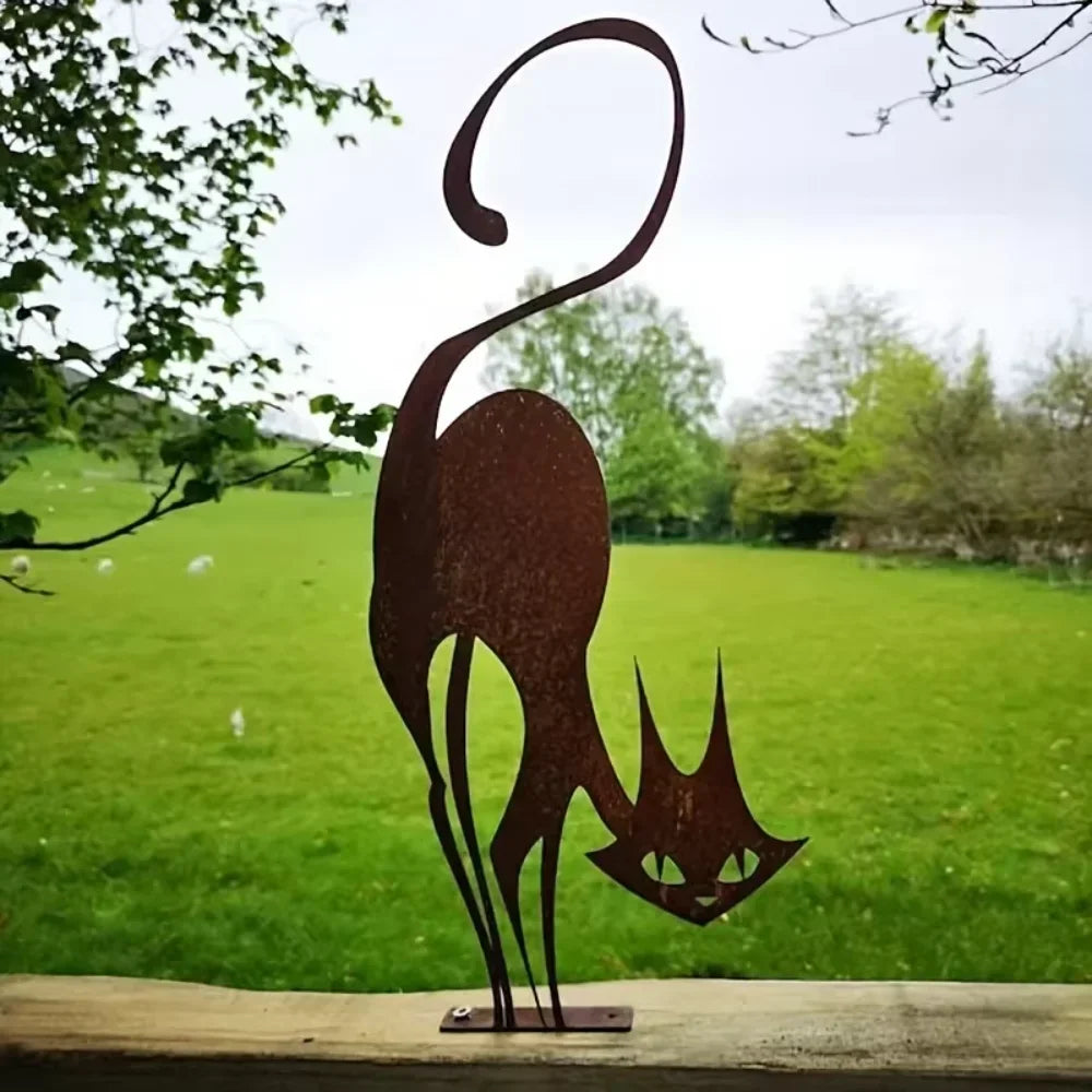 A silhouette of a cat with a curved tail and pointed ears made of rusted iron, set against a green field.