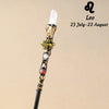 A natural clear quartz zodiac crystal wand for meditation and healing, featuring a gold-toned design.