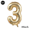 A large gold foil number balloon shaped like the number three for birthday and party decoration.