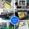 A hand draws a silhouette of a bird on a canvas print in a factory setting.