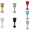 A collection of elegant cylinder flower vases in gold, silver, white, black, and pink.