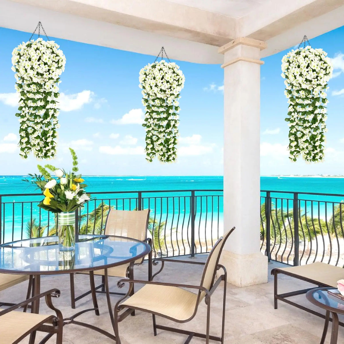 Artificial violet ivy hanging garland displayed outdoors on a balcony with a view of the ocean