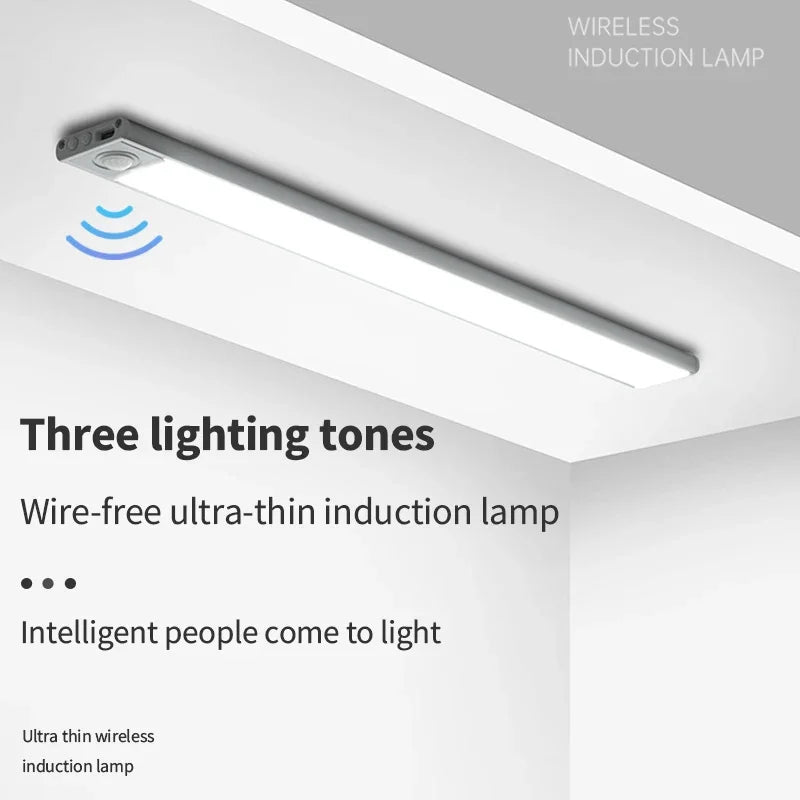 A white wireless induction lamp is mounted under a cabinet, illuminating the area.