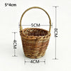 A handwoven rattan storage basket with handles, measuring 5x4cm.