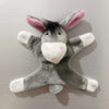 A gray elephant fridge magnet with pink ears and white accents.