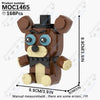 A brown and black collectible DIY model of a bear character with large blue eyes, shown against a white background.