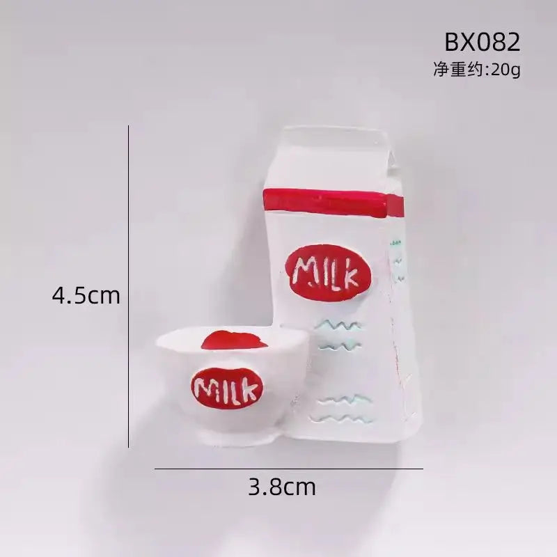 White fridge magnets shaped like milk containers, measuring 4.5cm by 3.8cm.