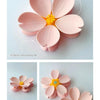 Pink magnetic cherry blossom sealing clips with a gold center and petal shapes