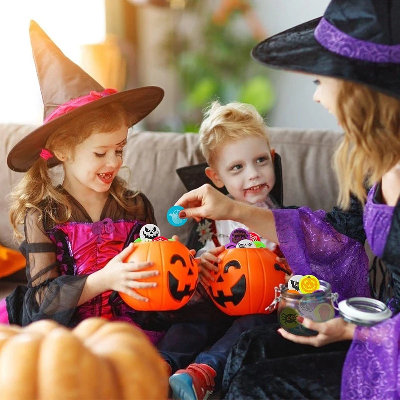 A young girl and boy are holding glowing orange Halloween pumpkins in a festive indoor setting.