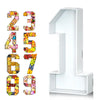 A set of colorful cardboard numbers 23456789 and a large number 1 displayed on a white stand.