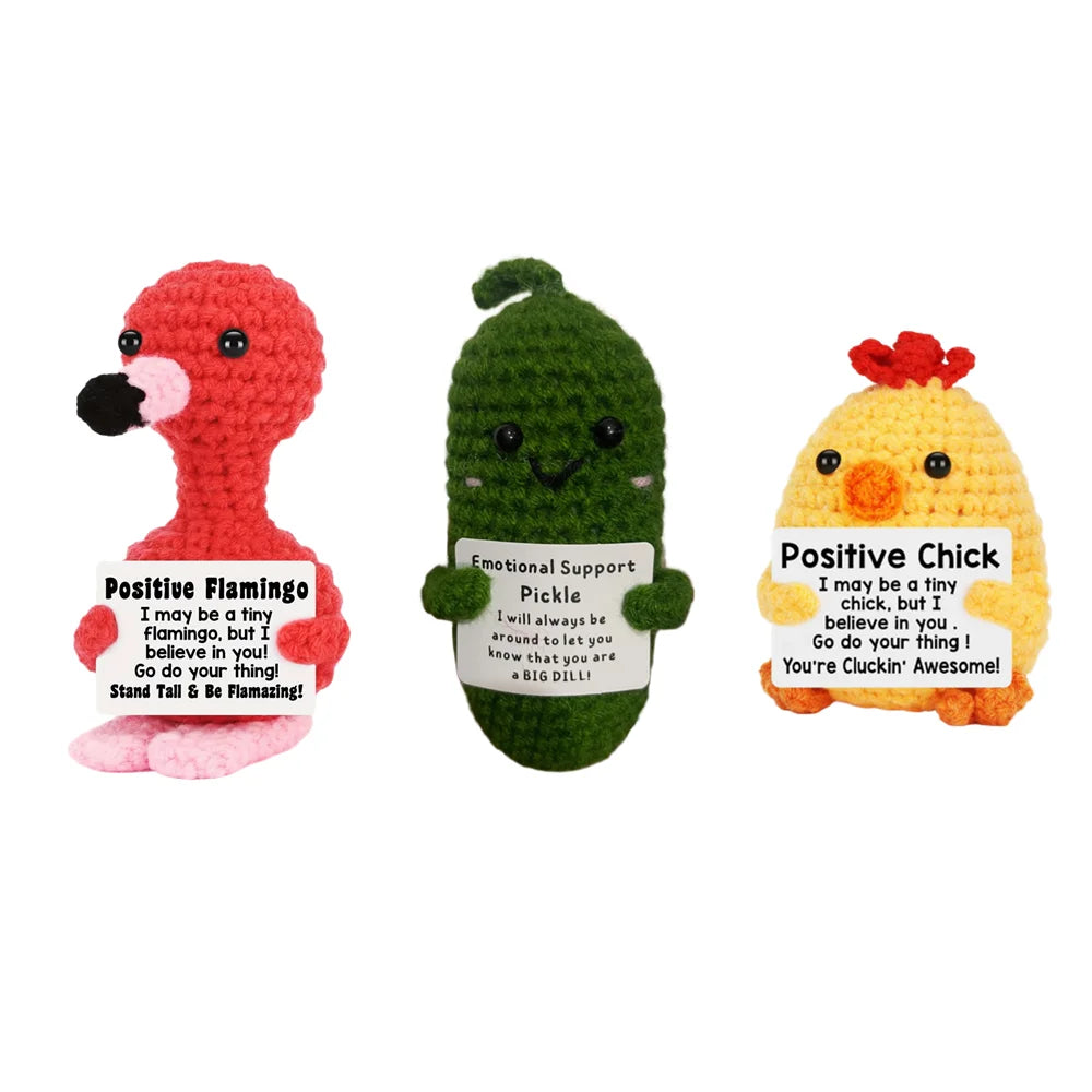 Three knitted plush dolls in red, green, and yellow featuring positive affirmations