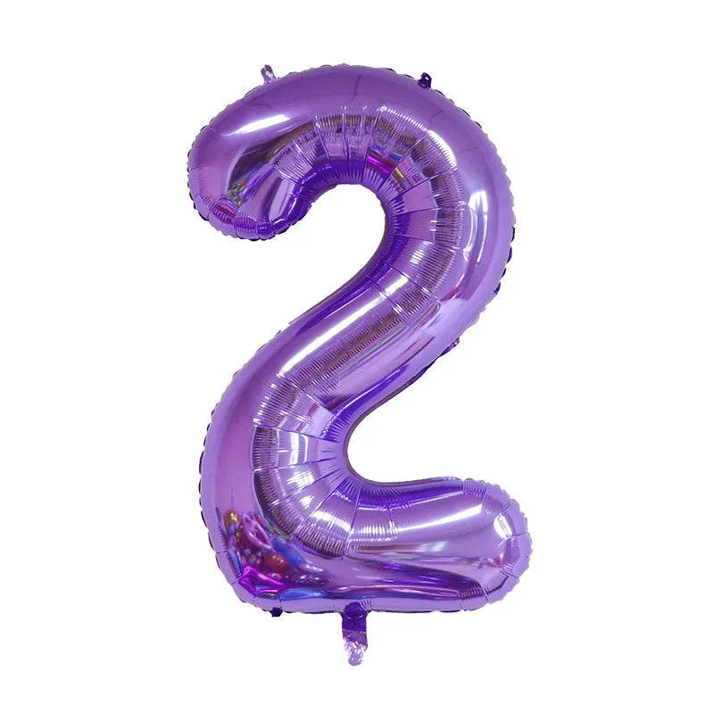 A purple foil balloon shaped like the number two for celebrations.
