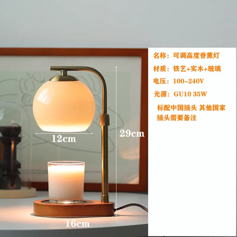 A modern brass aromatherapy wax melting lamp with a frosted glass shade and wooden base.