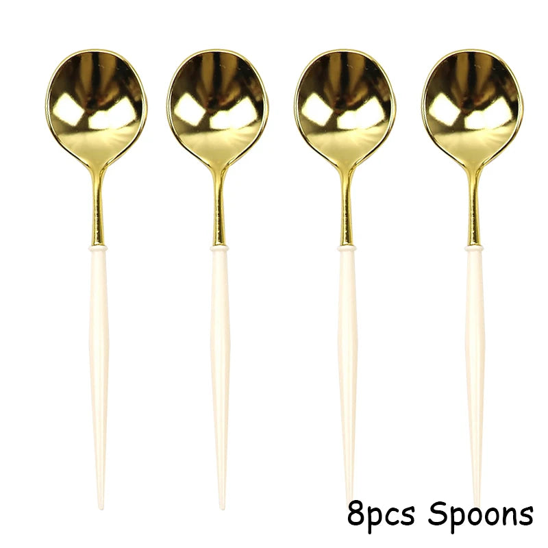 Eight gold disposable spoons with white handles