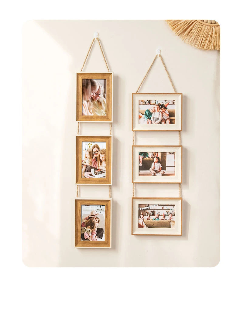 A vertical display of five wooden photo frames with gold string hangers, showcasing various pictures.