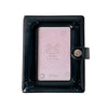 A black compact star-shaped photo card holder album with a pink insert and a bow design.