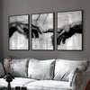 Three framed black and white canvas prints depicting hands in a spiritual theme