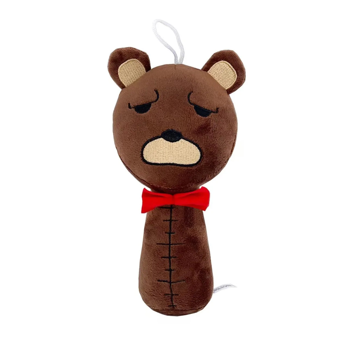 A brown plush toy resembling a bear with closed eyes and a red bow tie.