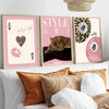 A set of three framed canvas wall art pieces featuring leopard and cheetah print designs in pink and gold tones.