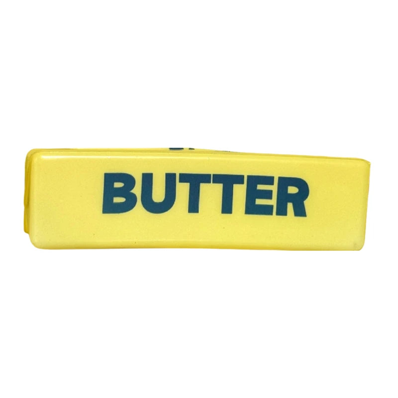 Jouet anti-stress rectangulaire jaune étiqueté BEURRE