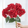 A cluster of bright red artificial hydrangea silk flowers on a green stem.