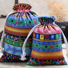 A colorful set of vintage cotton drawstring gift pouches featuring geometric patterns in various bright colors.